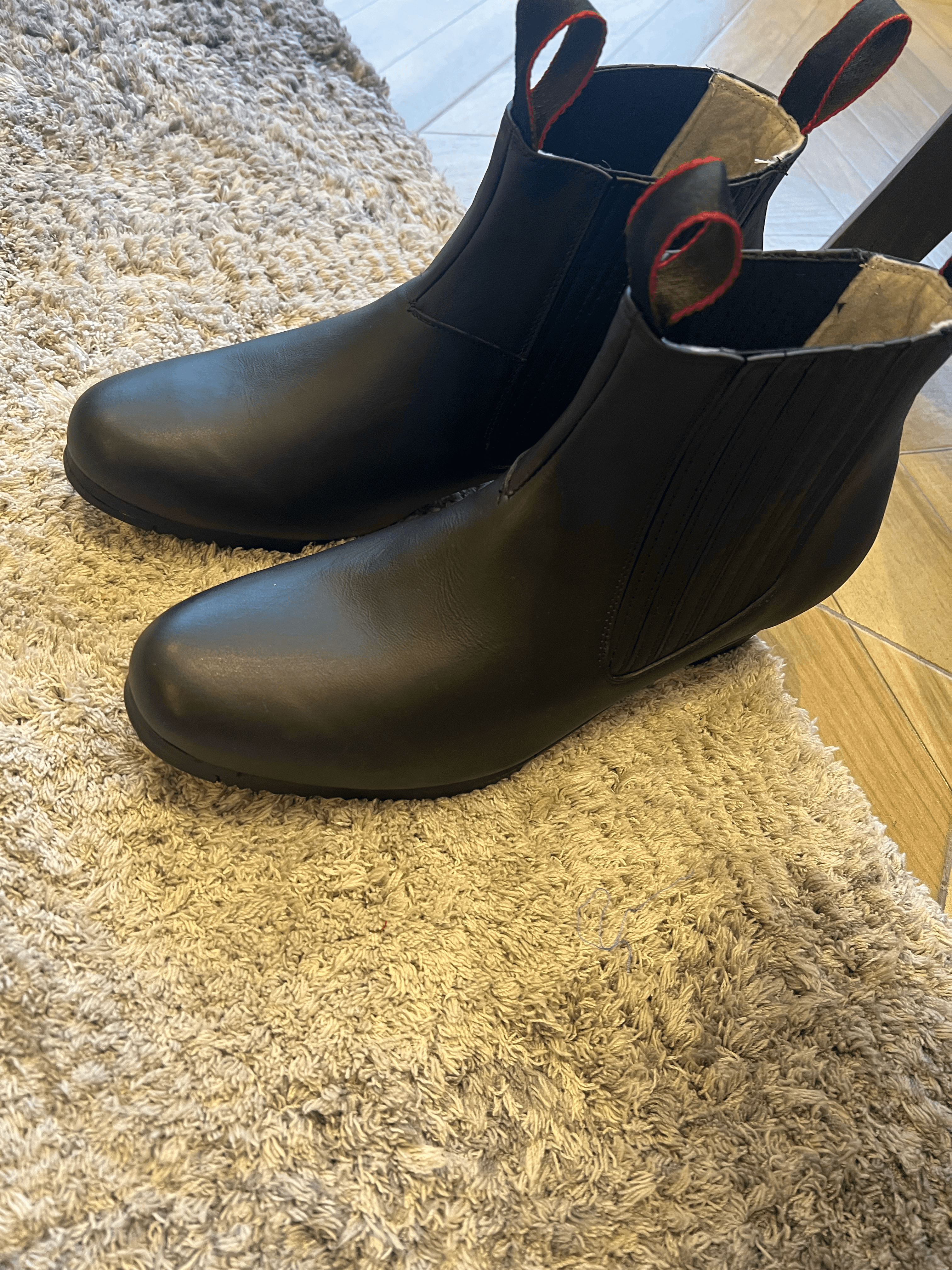 Close-up of tarima-ready black folklórico boots